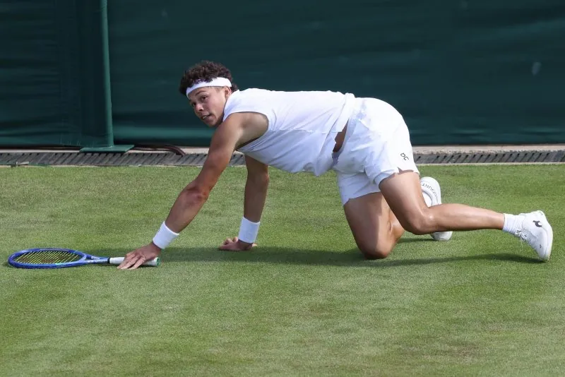 American Ben Shelton slips during his first-round meeting with Finland's Otto Virtanen at Wimbledon 2026 on Tuesday in London. Photo by Hugo Philpott/UPI