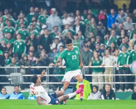 Jarell Quansah slides in on Jesus Gallardo during England’s victory over Mexico at the Azteca Stadium. The defender was shown a red card following a VAR review
