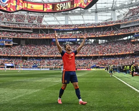 Spain's Mikel Merino celebrates after scoring his team's second goal in their World Cup quarter-final win against Belgium